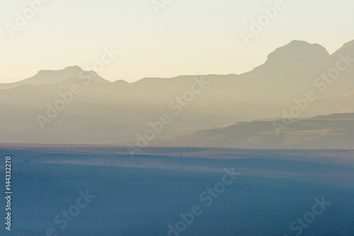 A winter fog settles over a valley in the early morning, Free state, South Africa. © dougholder