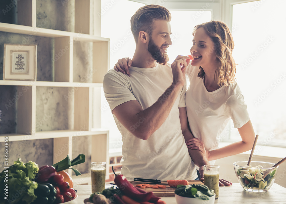 Couple cooking healthy food - obrazy, fototapety, plakaty 