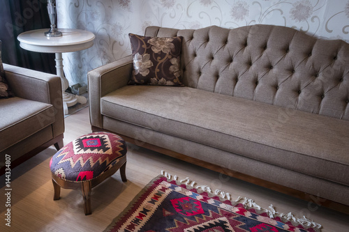 Ottoman with a sofa and rug