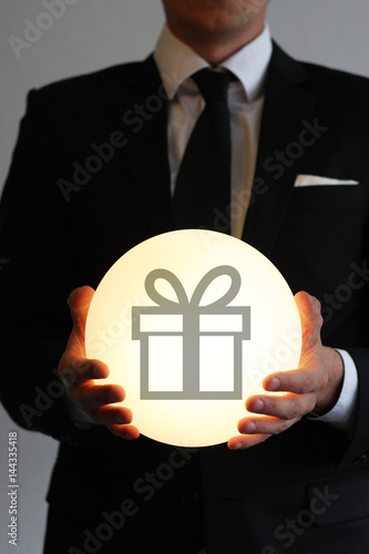 Businessman handing over a gift