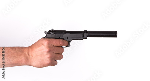 Hand with a pistol with a silencer