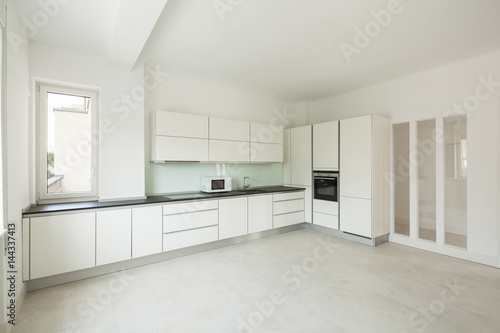 White modern kitchen in apartment