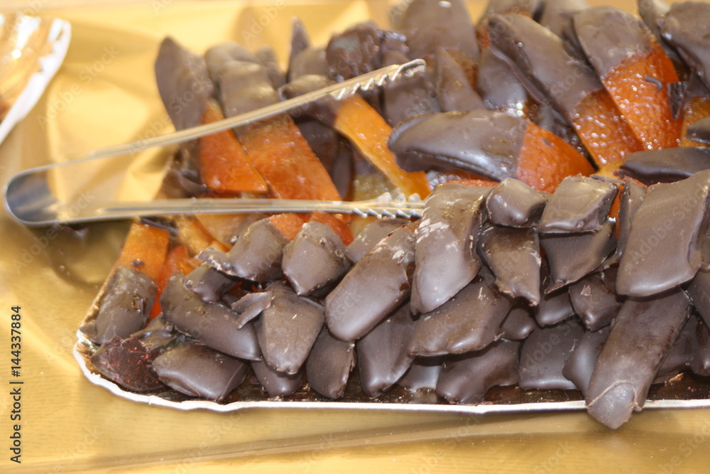 Fototapeta premium Candied orange dipped in chocolate