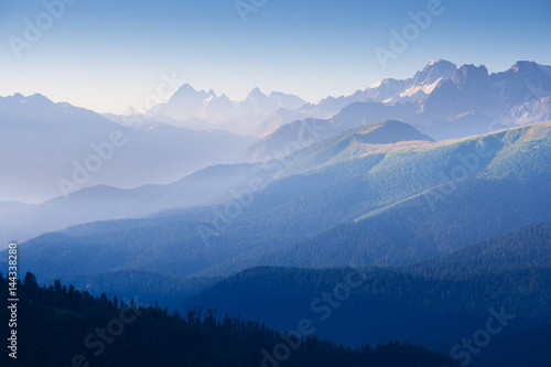 The first rays of the sun illuminate the mountain in the Western Caucasus © Vitalfoto