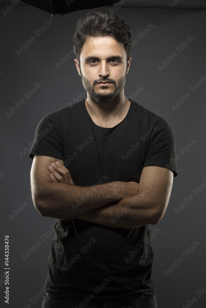 Caucasian guy wearing black T-shirt in studio Caucasian guy wearing black T-shirt in studio