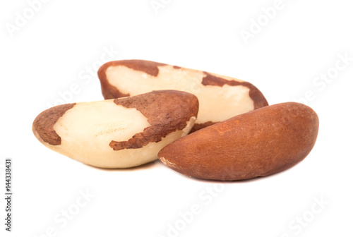 Three Brazil nuts isolated on white background