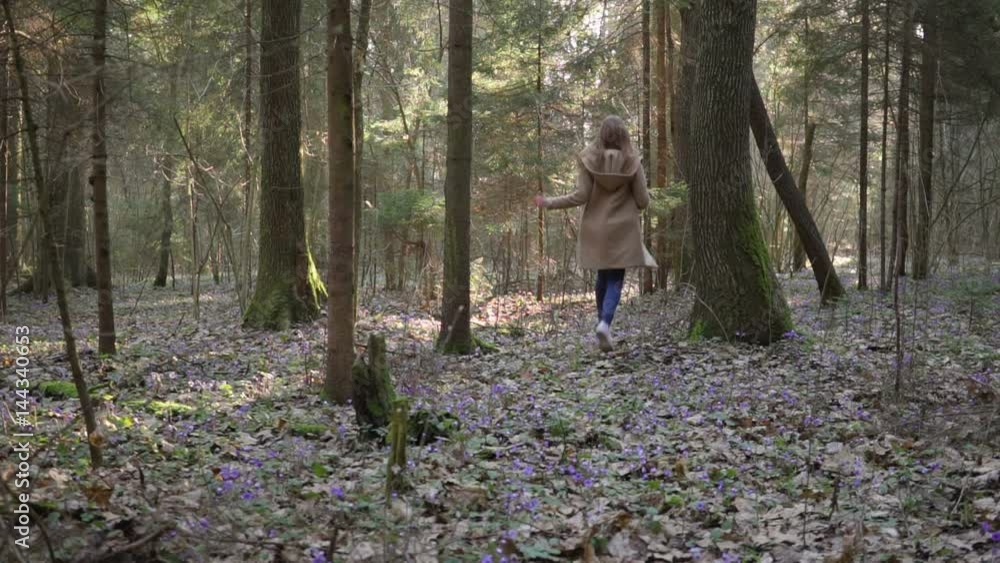 beautiful young girl runs through forest flowers beautiful young girl runs through forest flowers