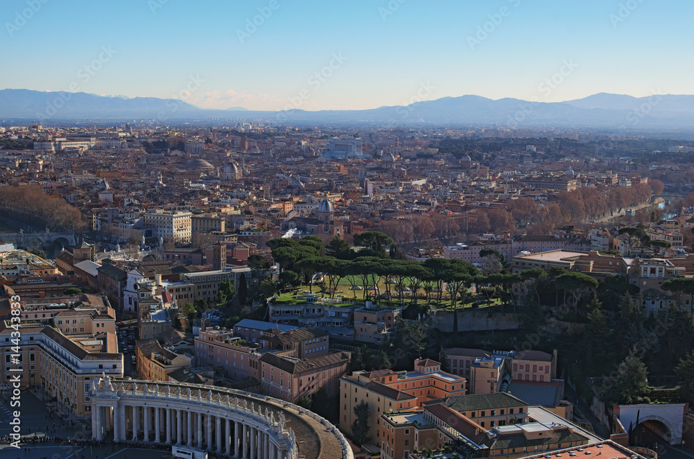 View to rooftops of Rome skyline from the top of dome Saint Peter's Basilica. Winter morning. Rome. Italy