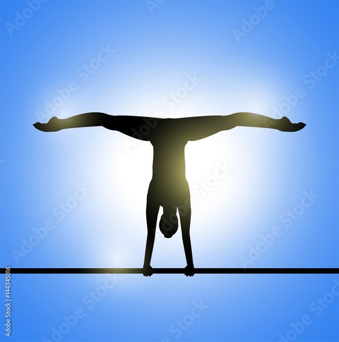 atleta ginnasta durante un esercizio su parallele