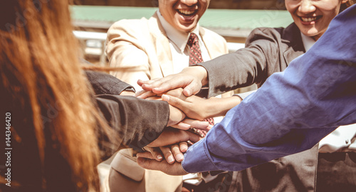 Fototapeta Naklejka Na Ścianę i Meble -  Business teamwork concept,hands of businessmen and businesswomen together, hand stack.