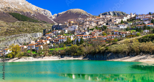 Pictorial emerald lake - Lago di Barrea and medieval village in Abruzzo, Italy photo