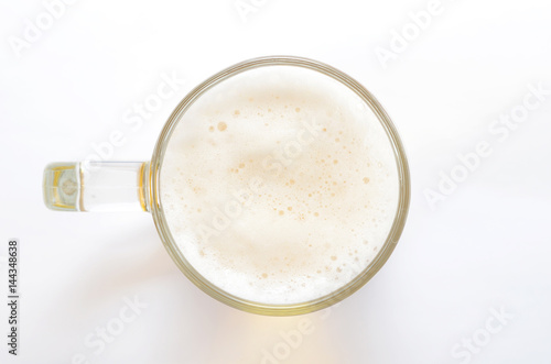 Top view on beer glass on white background