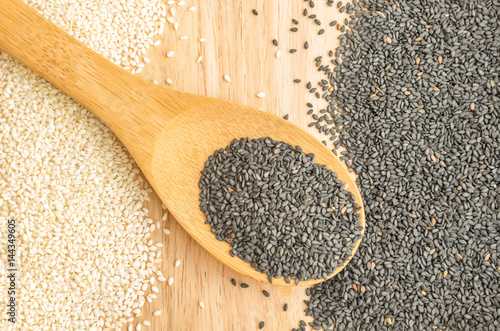 Black and White Sesame Seeds on Wooden Background