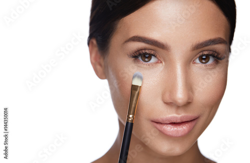 Beauty. Woman Face With Brush.  Makeup Cosmetics