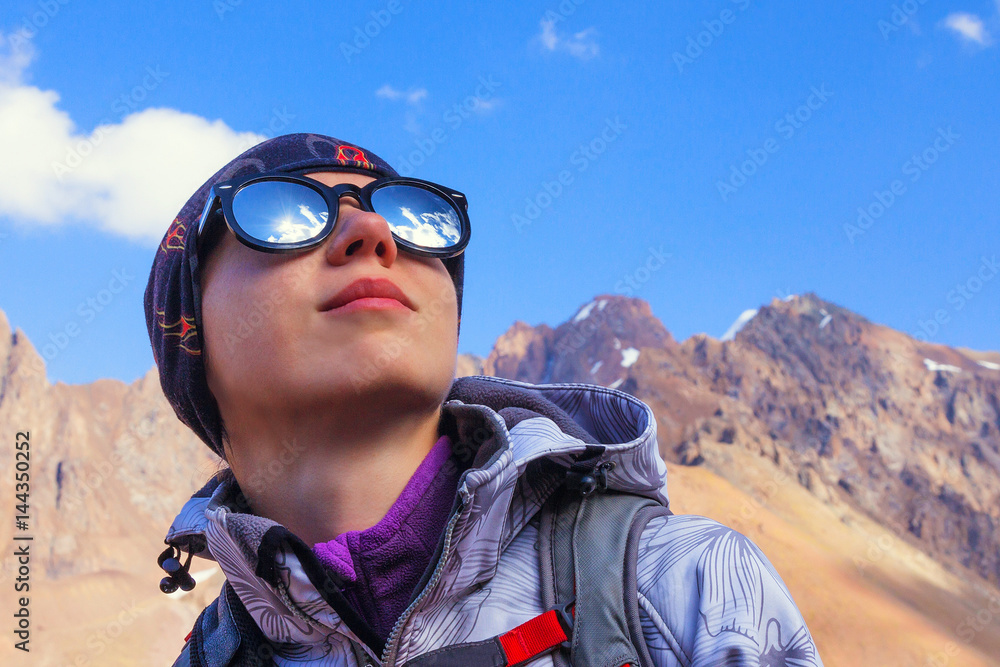 Girl in sunglasses. Looks up at the sky. Girl in sunglasses. Looks up at the sky.
