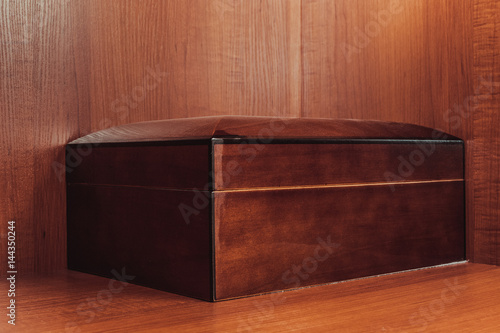 A cigar box for a cigar in a cupboard