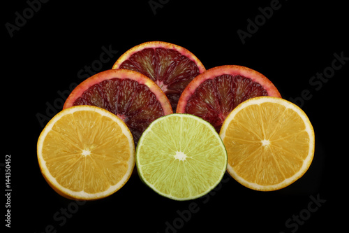 set of citrus clices on black background photo