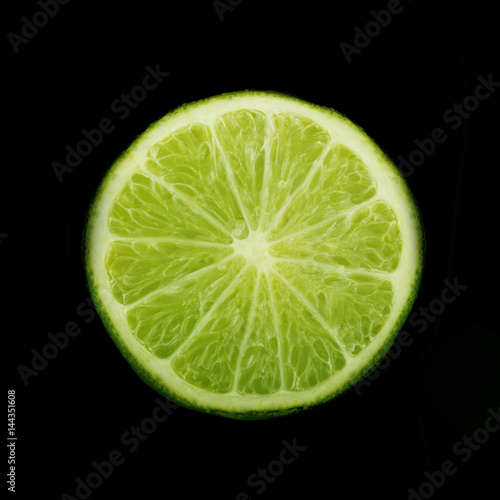 lime slice on black background isolated © lewal2010
