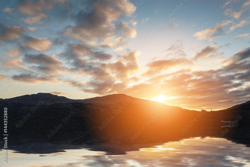 Fototapeta premium Sunset with Intense Colours and Beautiful Clouds over a Lake