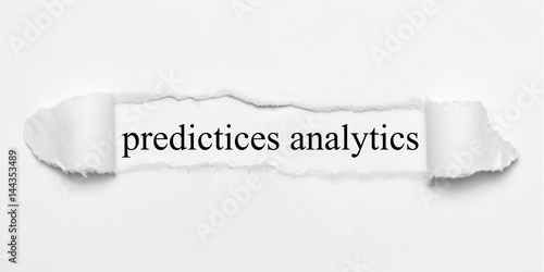 predictives analytics on white torn paper photo