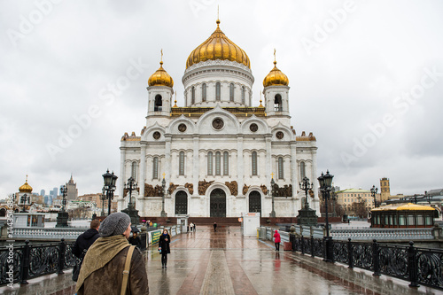 Apr 17, 2015 - Moscow, Russia : tourist walking in front of Cathedral of Christ the Savior on the rainy day.