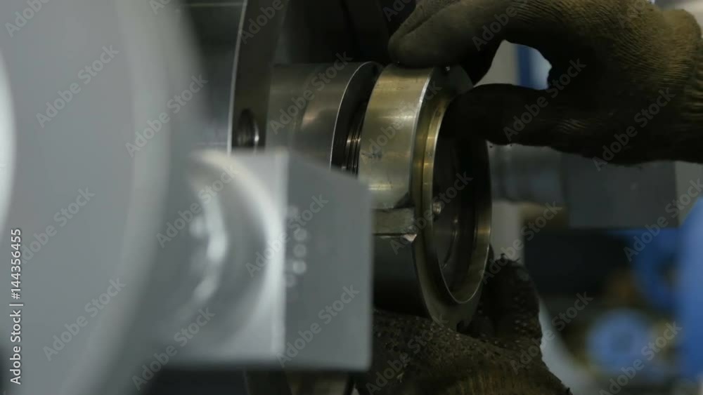 Closeup Worker Hands Bind Part to Compressor in Workshop Closeup Worker Hands Bind Part to Compressor in Workshop