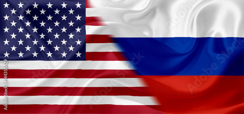 Waving flags of United States of America and Russia with fabric texture