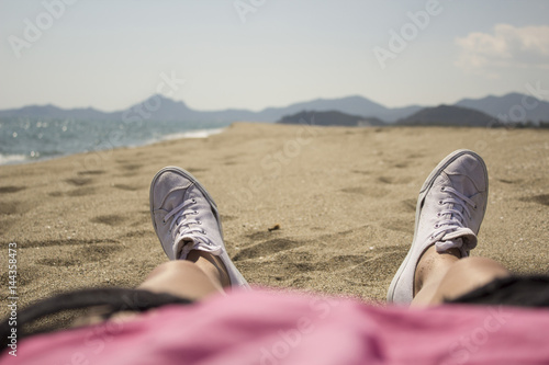 Rest under the scorching sun on the sandy beach of the island of Sardinia near Muravera. Italy photo