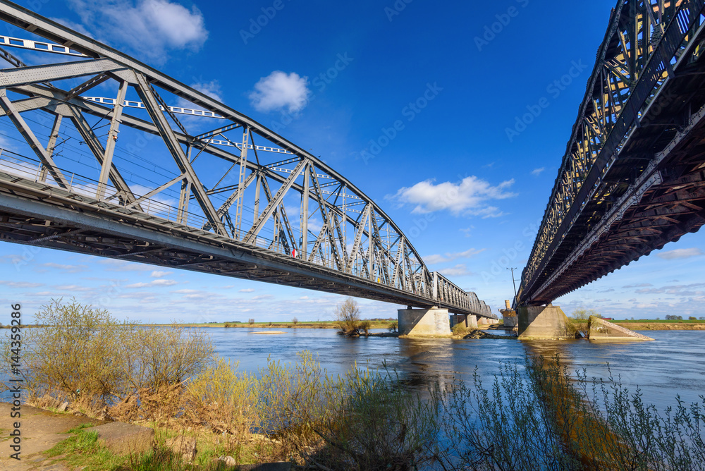 The historic pair of bridges over Vistula river, a road one and a railroad one. The bridges are 837 meters long. Tczew, Poland. Europe.