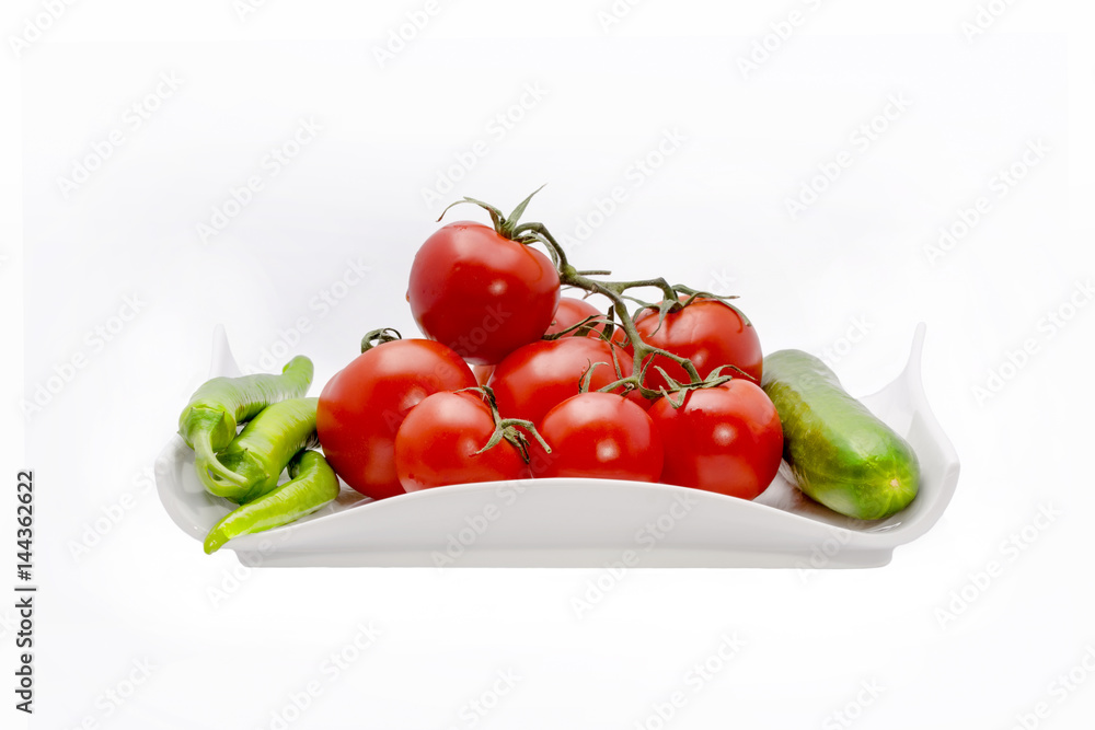 tomato and chili pepper on a white background tomato and chili pepper on a white background