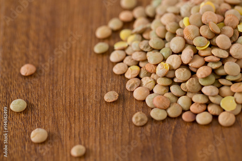 lentils on wooden surface