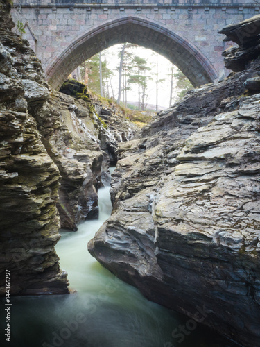 Fast Flowing River Motion Blur With Bridge In Background - Linn O' Dee  Gorge - Aberdeenshire, Scotland