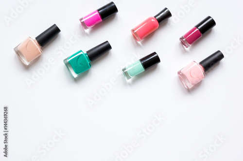 hands care concept with nail polish white desk background top view mock-up