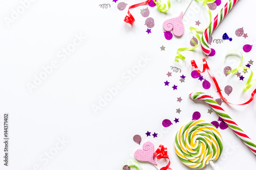 party set with lollipop and confetti on white background top view mock up