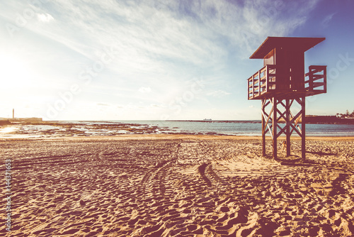 Lifeguard baywatch tower on the sandy beach