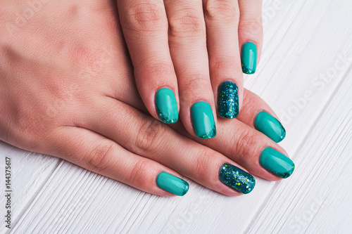Turquoise nail art with tinsels