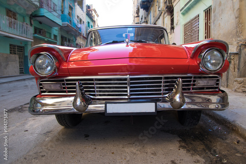 Red oldtimer car in Havana © Geza Farkas