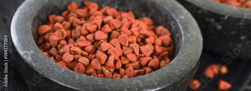 Annatto Seeds - Annatto (achiote) seeds in a black bowl.