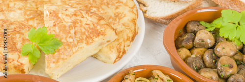 Spanish Tortilla - Traditional Spanish omelette made with potatoes and fried in olive oil served with a selection of tapas dishes.