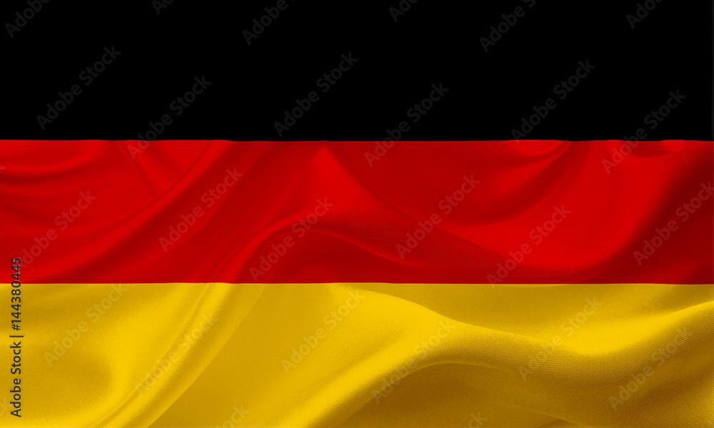 Naklejka premium Waving flag of Germany with fabric texture
