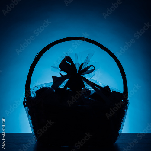 gift basket silhouette on blue background