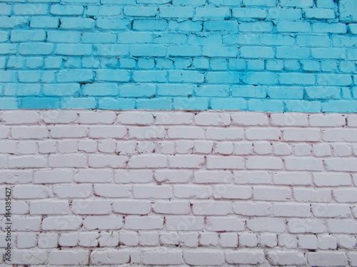 Old brick wall blue in the top and white-pink from below.