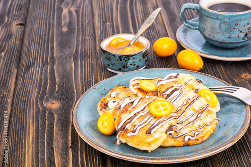 Pancakes with chocolate and kumquats