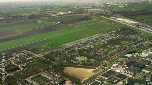 The plane flies over Netherlands on approaching the Amsterdam. Zwanenburg. Vinkebrug photo