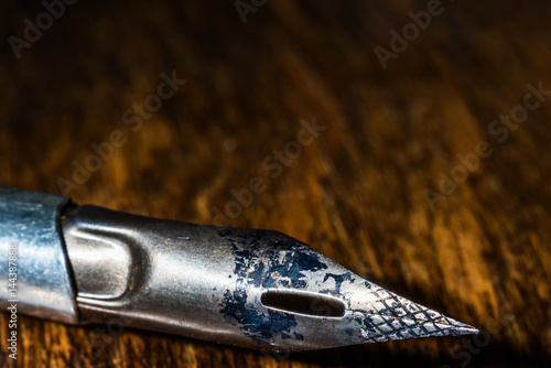 Old vintage pen close on a wooden table