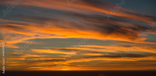 Wispy Sunset Clouds over the Ocean