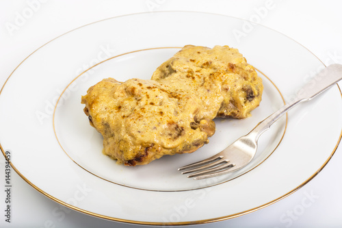 Chicken in curry sauce on white background