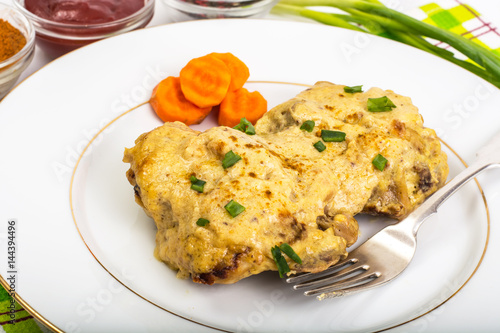 Chicken in curry sauce on white background