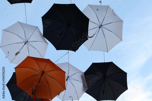 Low Angle View Of Colorful Umbrellas Hanging Against Sky