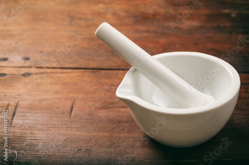 Tela Mortar and pestle on wooden background